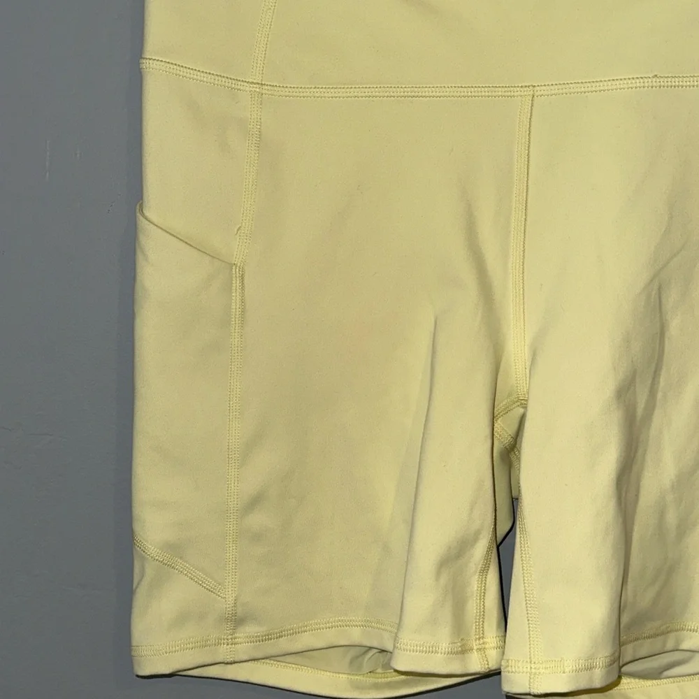 Fabletics Pale Yellow Bike Shorts with Side Pockets - Picture 2 of 6